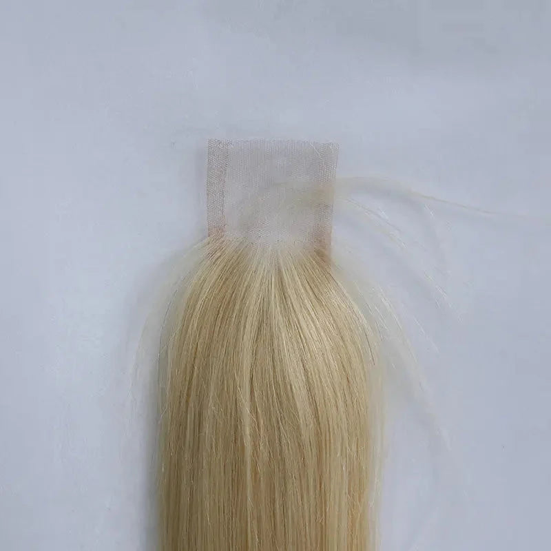 Close-up of 613 Blonde closure lace and roots