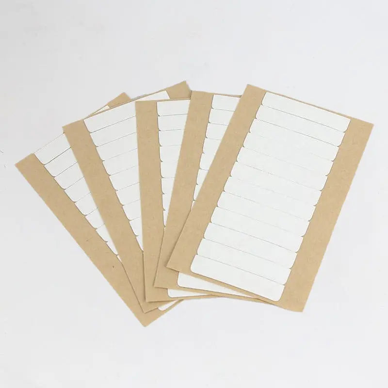 Replacement tape refills: Replacement tape sheets fanned across a white background