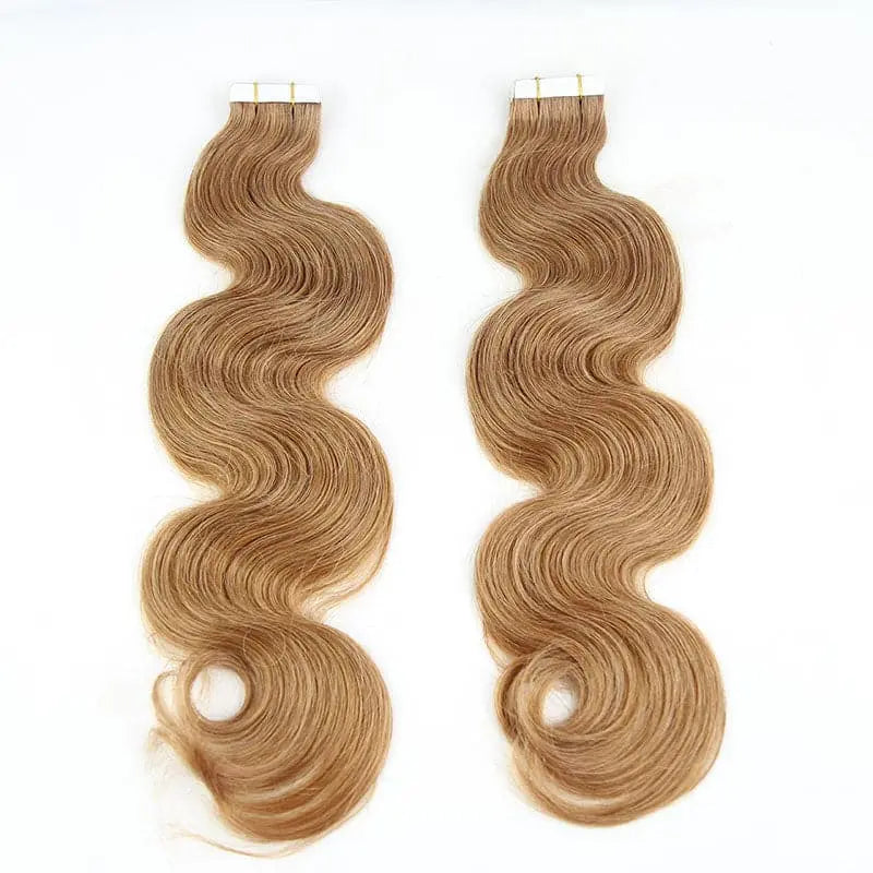 Body Wave tape-in extensions in #30 color: Two warm-colored wavy sections shown upright