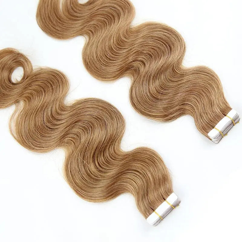 Body Wave tape-in extensions in #30 color: Close-up of the attachment ends beside flowing waves