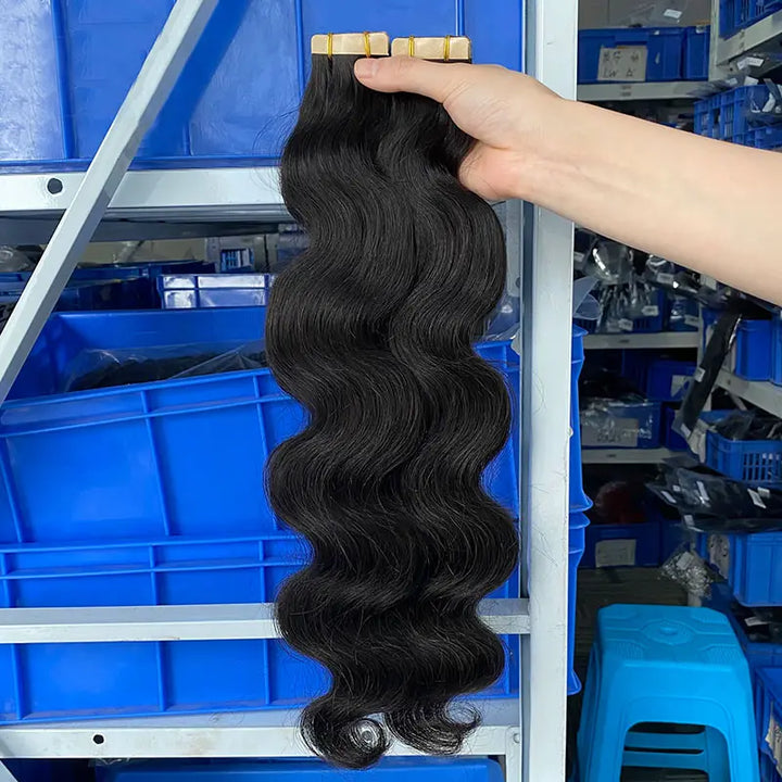 Body Wave tape-in extensions: Wavy extensions held to show their shape