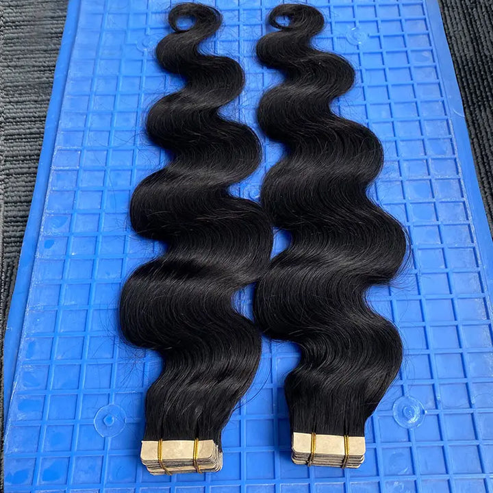 Body Wave tape-in extensions: Loose waves with the attachment ends visible
