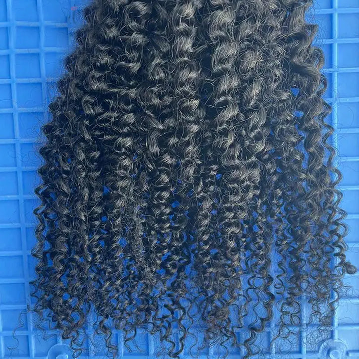 Kinky Curly tape-in extensions: Close-up of defined curls and the hair ends
