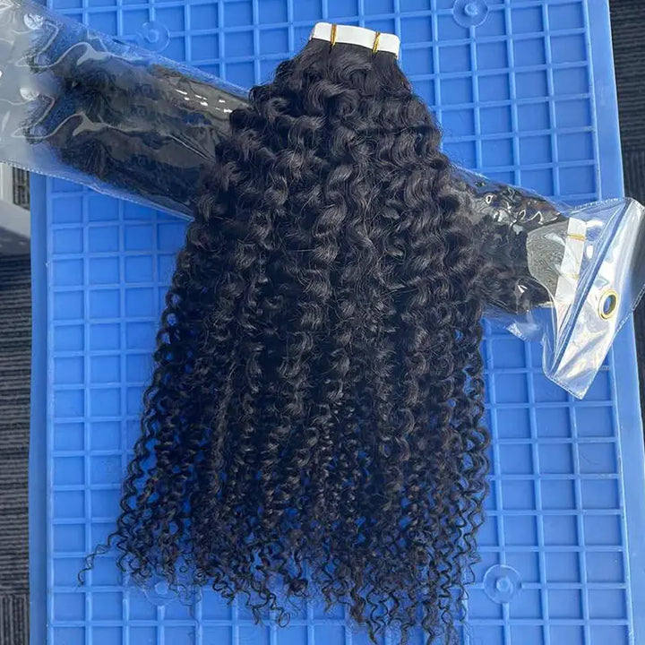 Kinky Curly tape-in extensions: Curly wefts shown beside their packaging