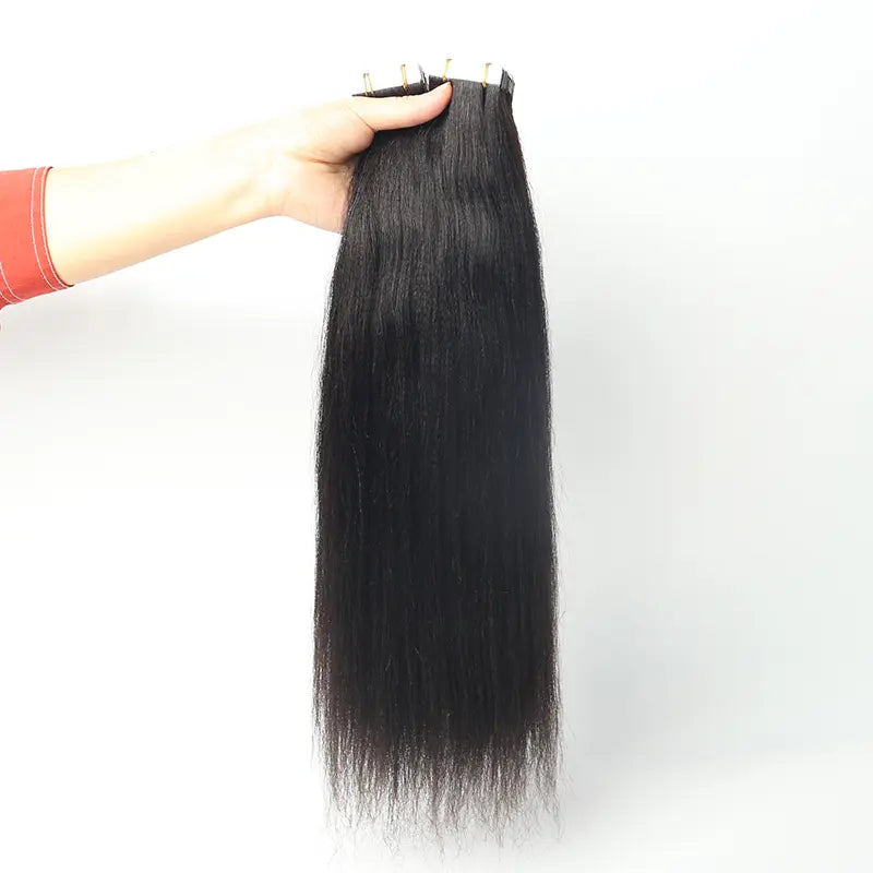 Light Yaki Straight tape-in extensions: Front view of extensions held by the attachment edge