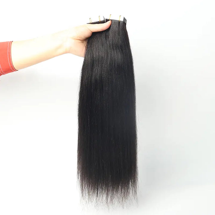 Light Yaki Straight tape-in extensions: Front view of extensions held by the attachment edge