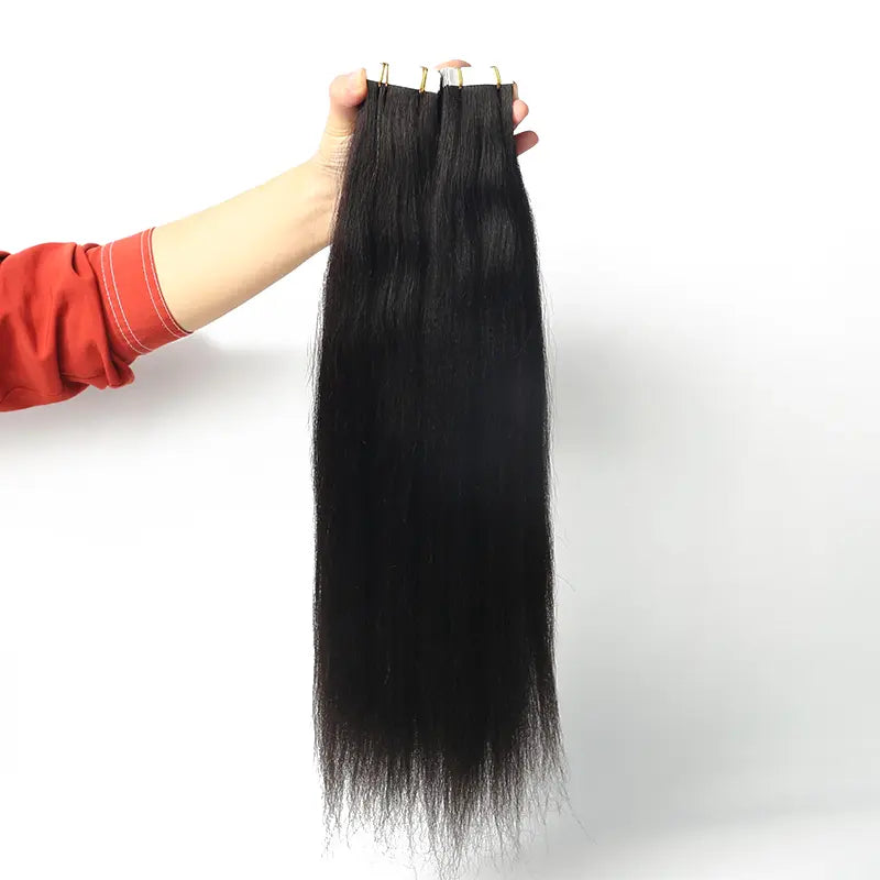 Light Yaki Straight tape-in extensions: Reverse view of extensions held by the attachment edge