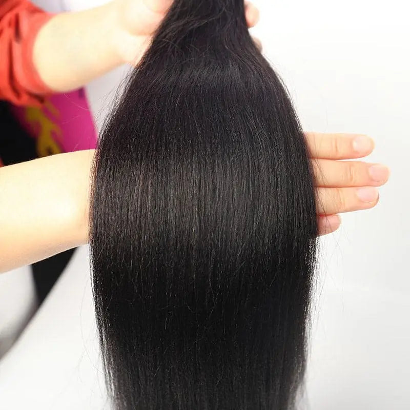 Light Yaki Straight tape-in extensions: Close-up of the smooth, lightly textured lengths