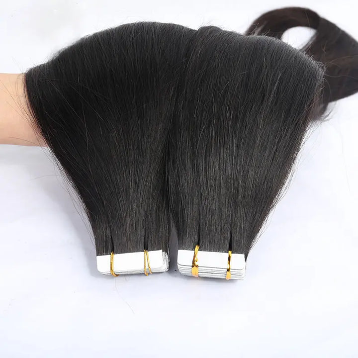 Silky Straight tape-in extensions: Straight lengths fanned across a hand