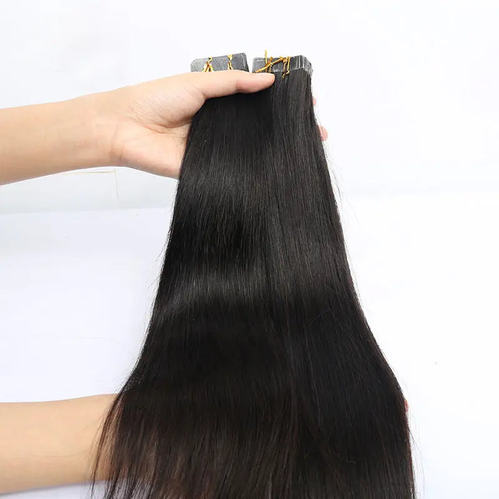 Silky Straight tape-in extensions: Straight extensions held to show the full length