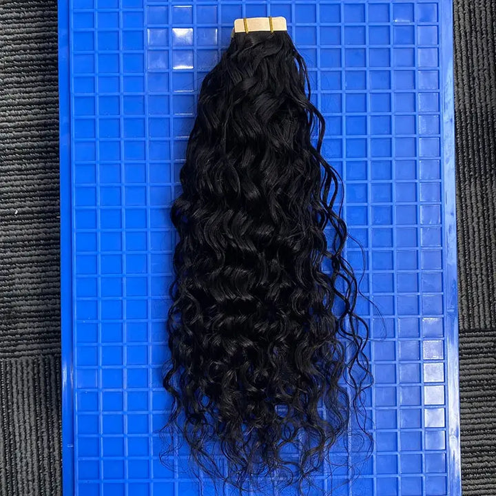 Water Wave tape-in extensions: Wavy wefts hanging against a blue background